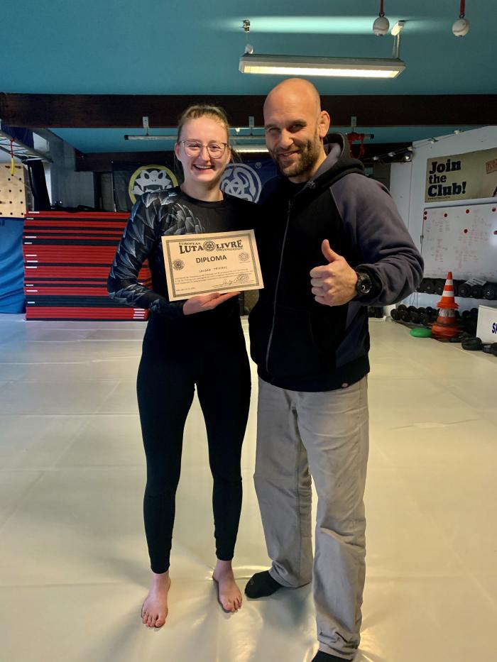 trainer license and first stripe on my purple belt
